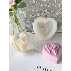 Silicone mold with hands inside the heart